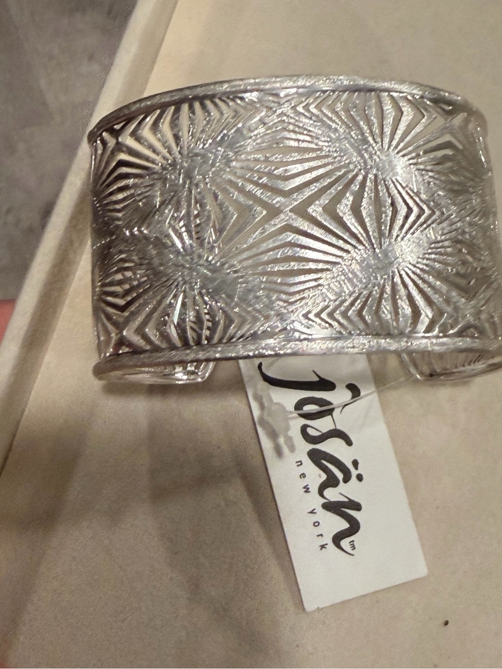 Josän New York silver cuff bracelet with striking geometric starburst pattern